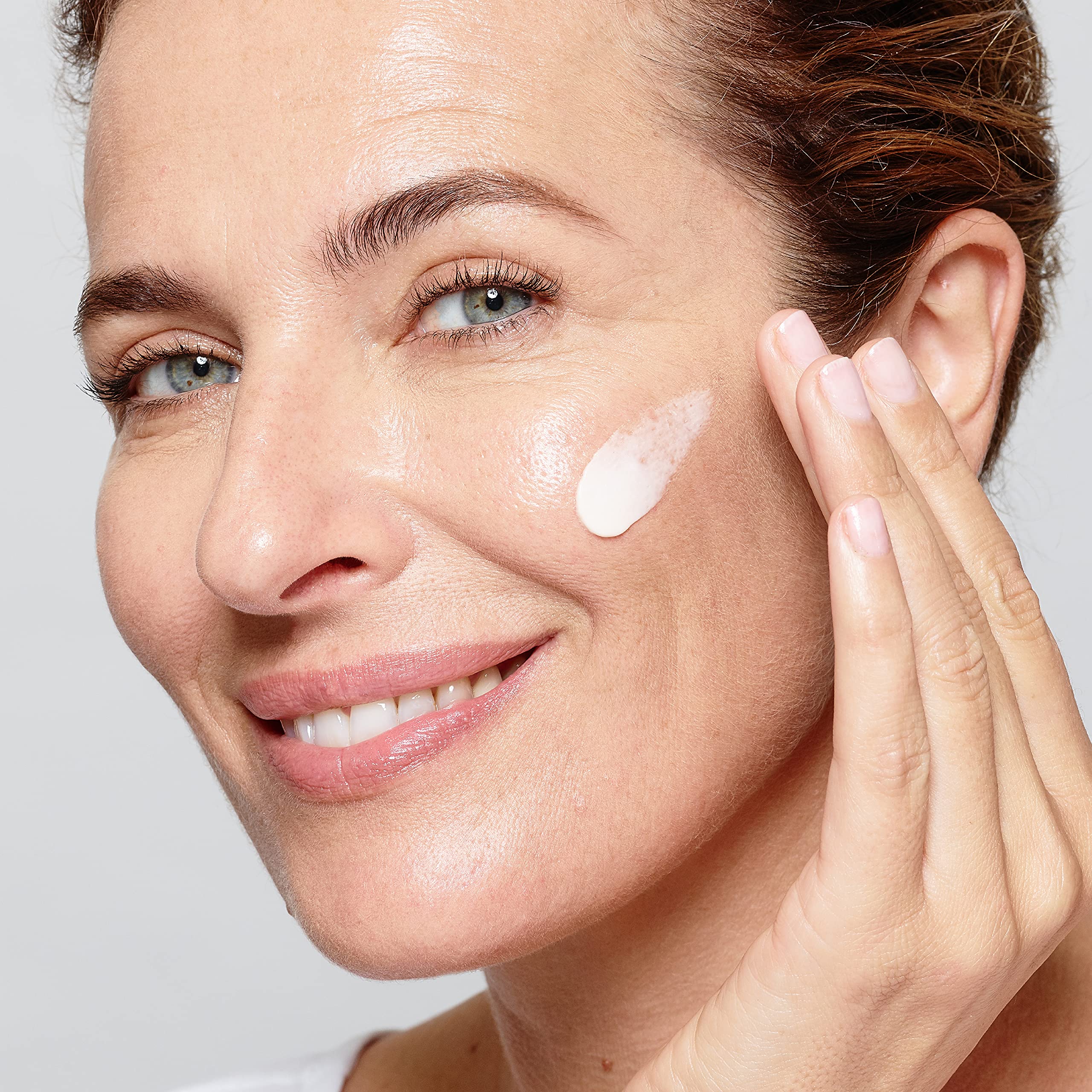 L'Oreal Paris cream absorbed into skin close-up showing non-greasy finish