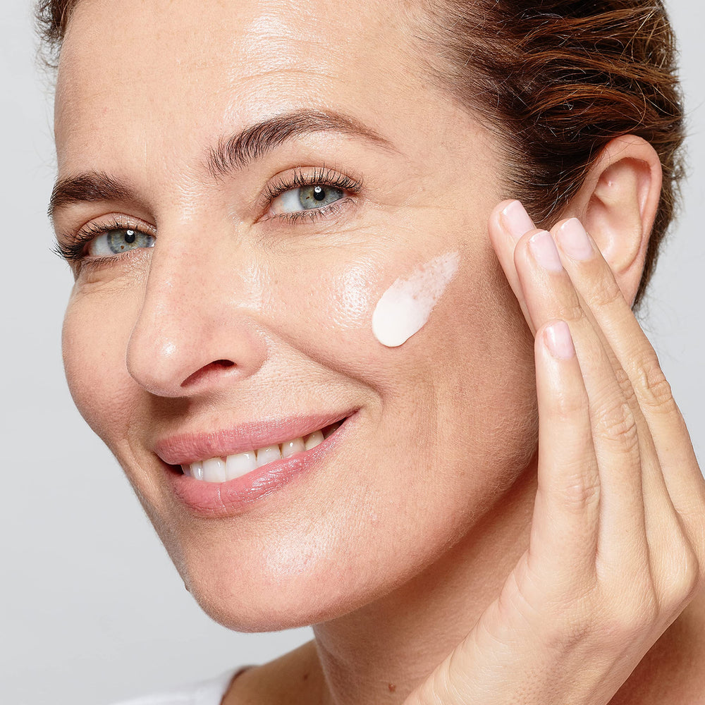 L'Oreal Paris cream absorbed into skin close-up showing non-greasy finish