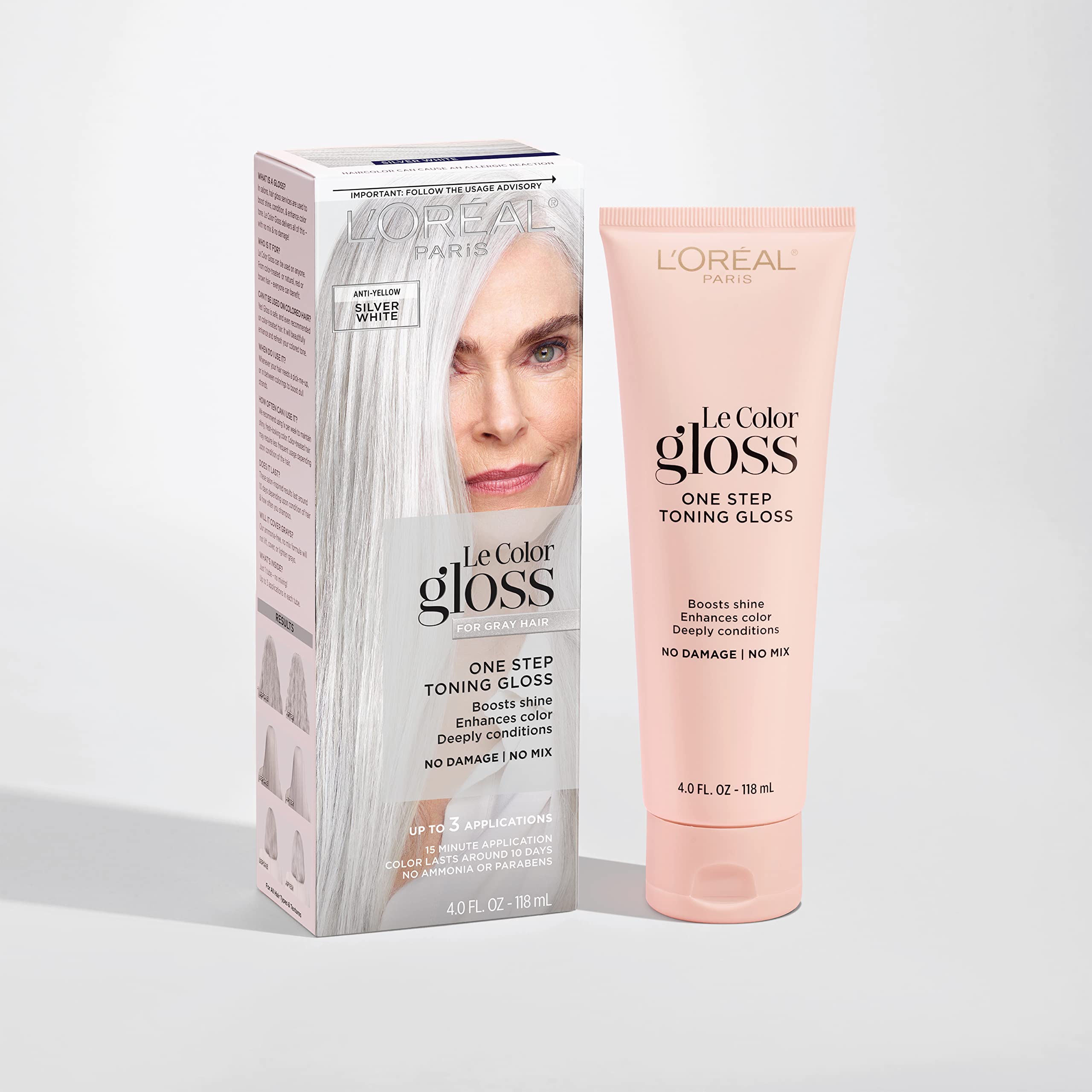 L'Oreal Paris gloss tube with cap off, texture visible, showing creamy conditioning formula
