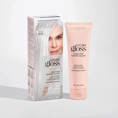 L'Oreal Paris gloss tube with cap off, texture visible, showing creamy conditioning formula