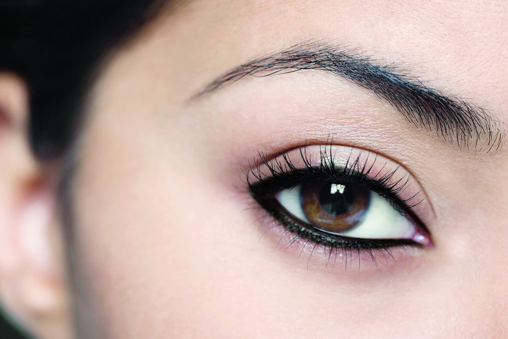 L'Oreal Paris eyeliner in use on model enhancing lash line for defined eyes