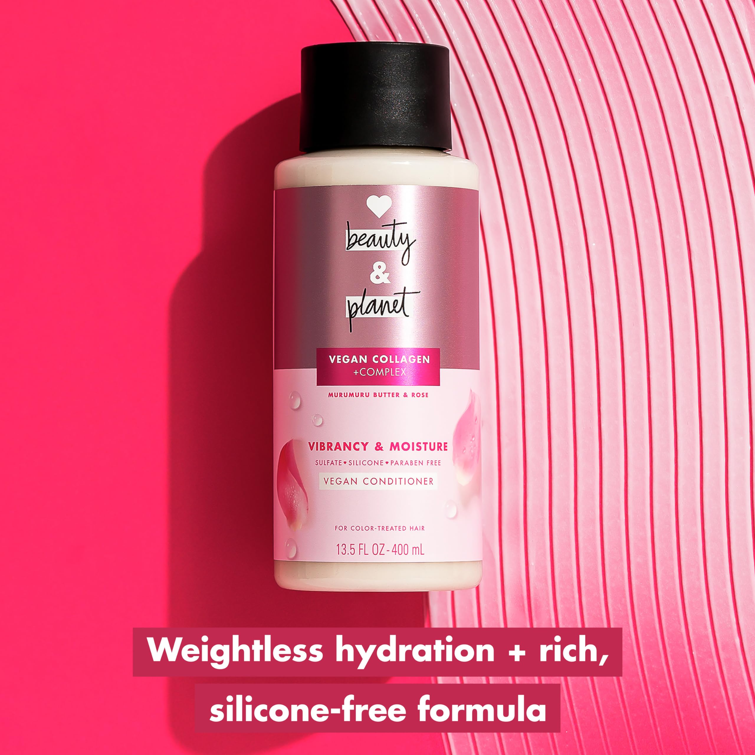Love Beauty and Planet applying conditioner to mid-lengths for detangling benefit