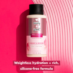 Love Beauty and Planet applying conditioner to mid-lengths for detangling benefit