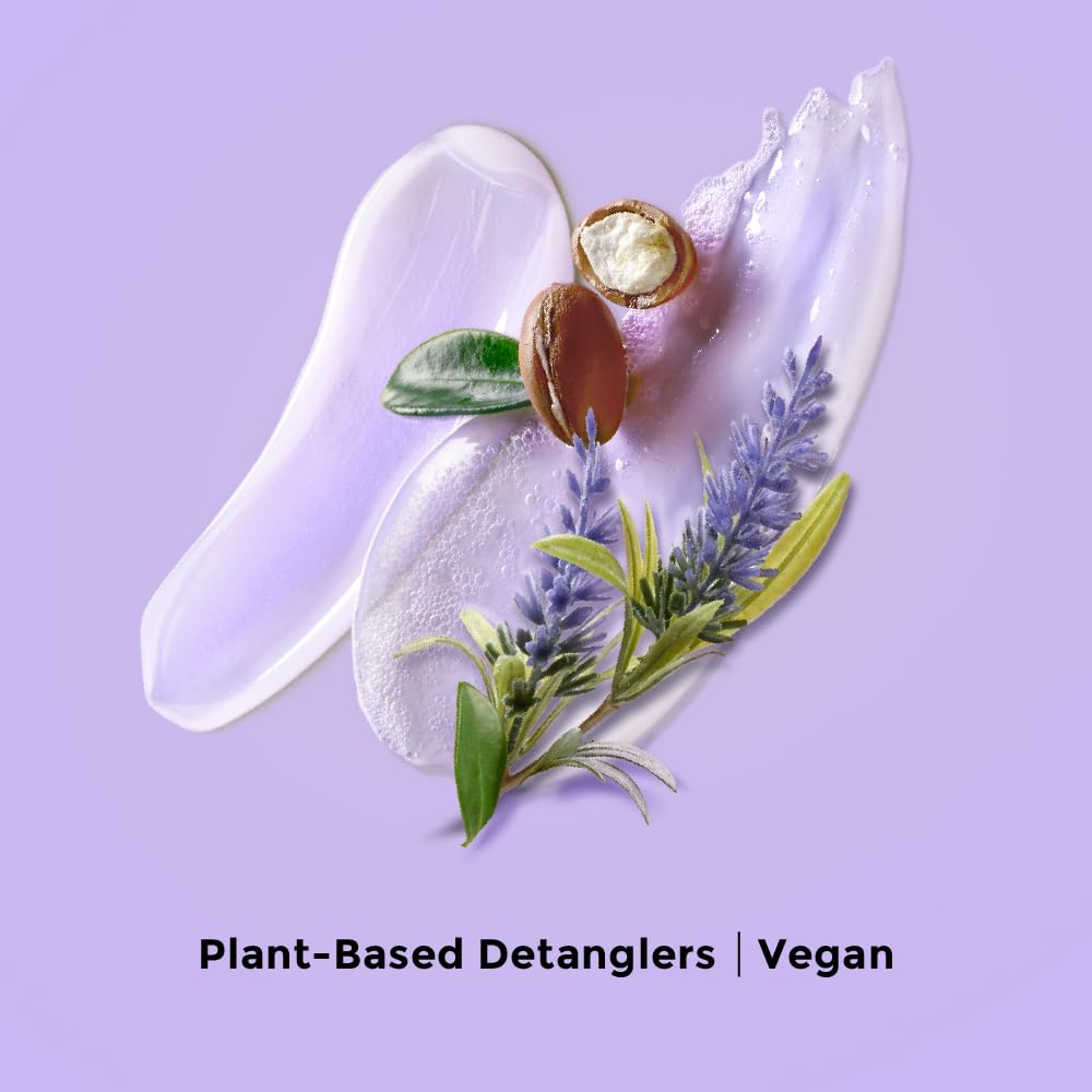 Love Beauty And Planet creamy conditioner texture on hand showing detangling slip