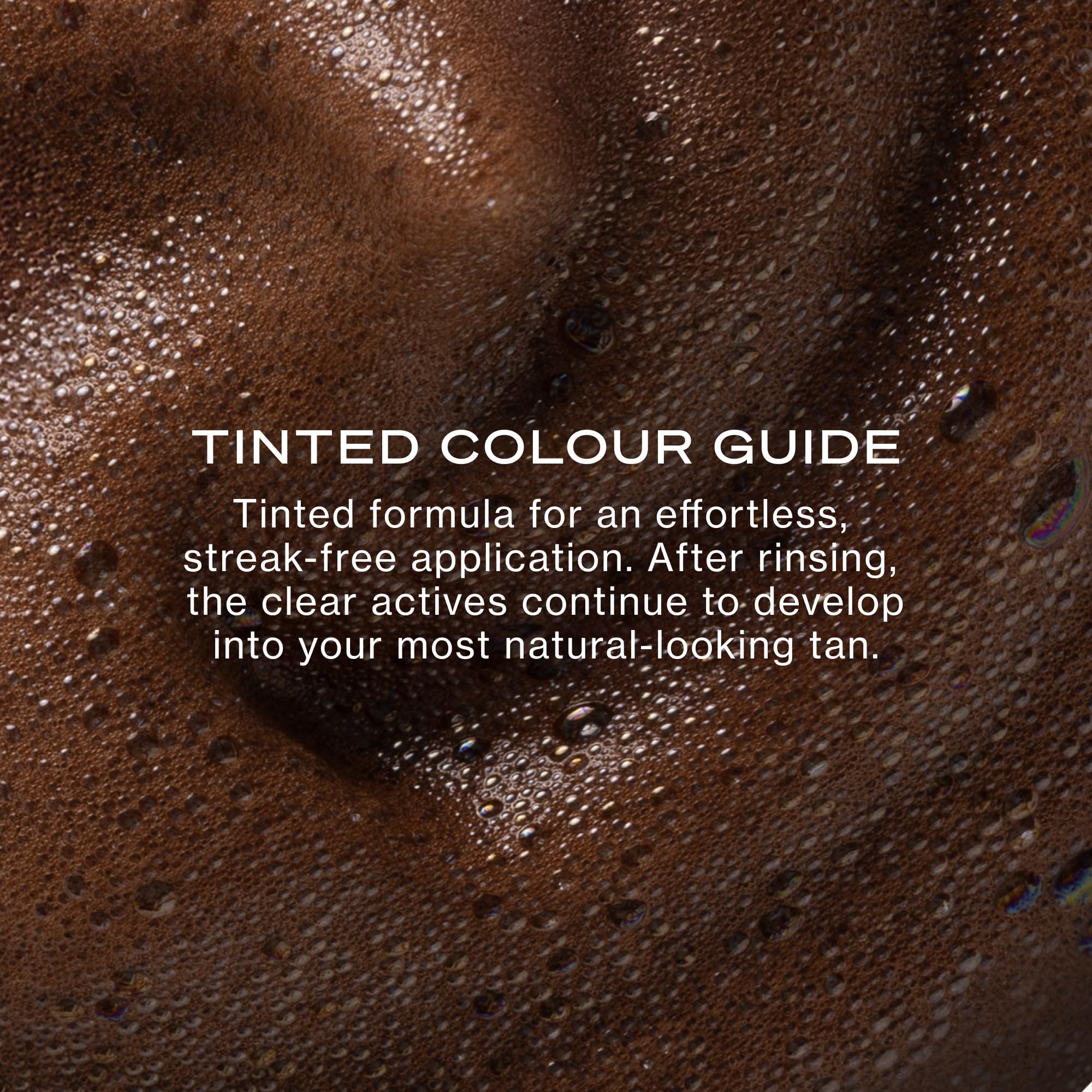 Loving Tan applicator mitt applying mousse for streak-free coverage