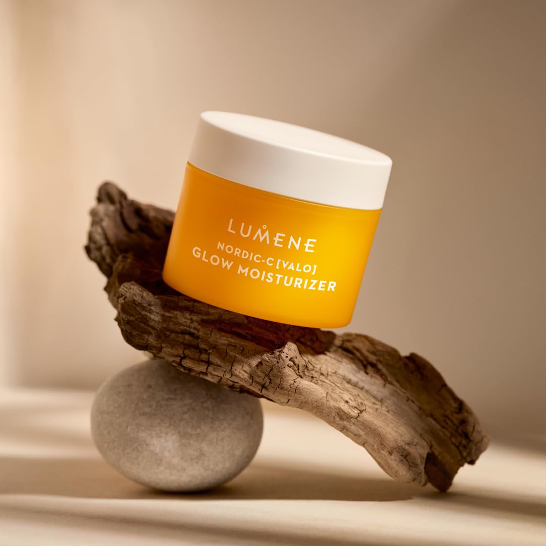 Lumene Nordic-C dispensed amount on fingertip illustrating lightweight feel