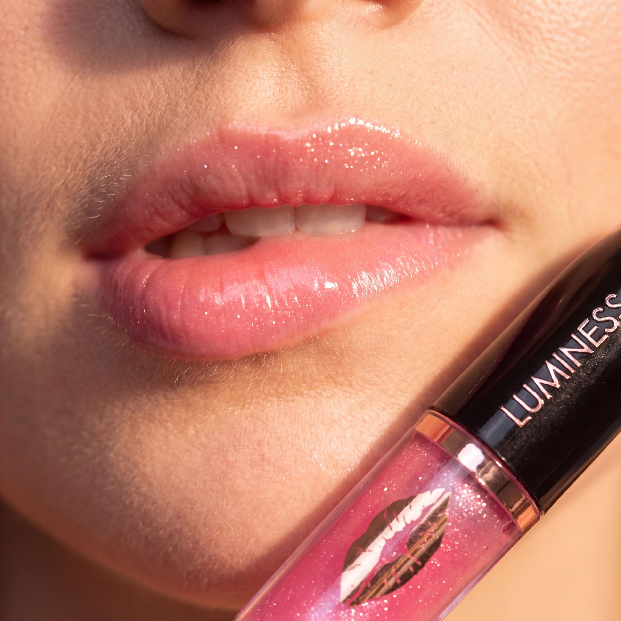 LUMINESS model wearing gloss showing hydrated fuller-looking lips