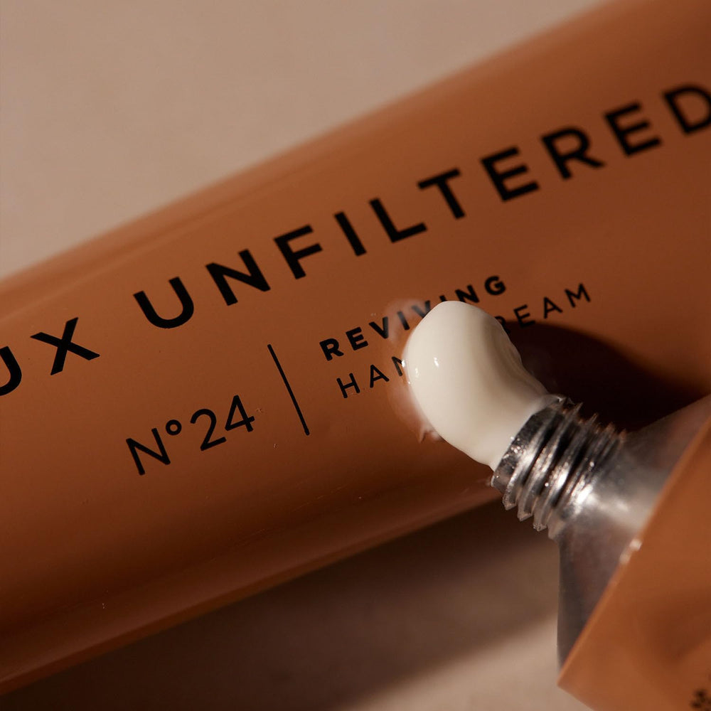+ Lux Unfiltered cream on back of hand showing smooth finish and softening benefit