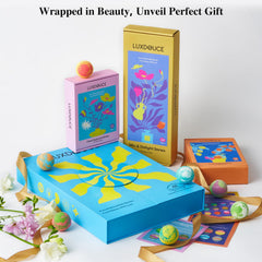 LUXDOUCE three themed boxes open displaying assorted bath bombs for choice