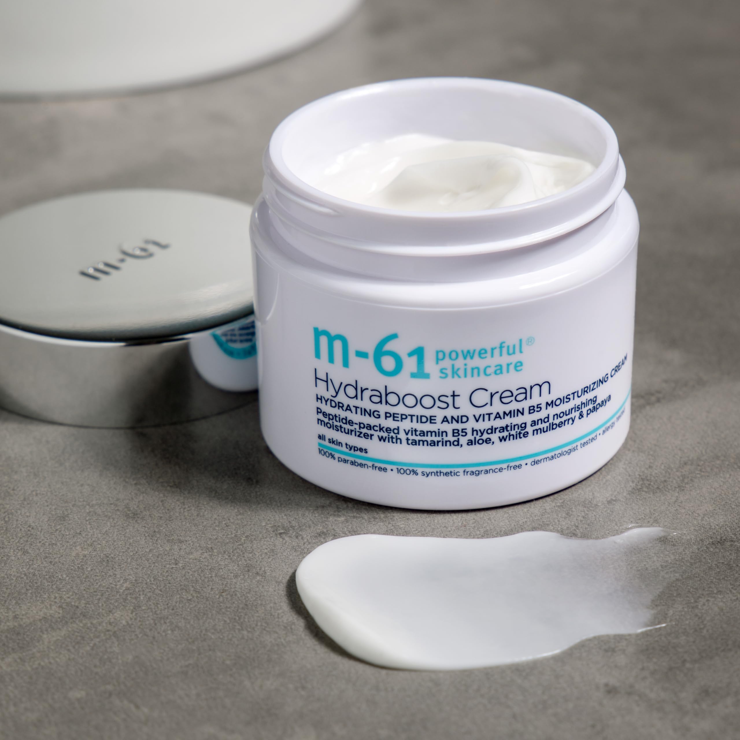m-61 jar next to ruler for 1.7 fl oz size comparison and travel-friendly benefit