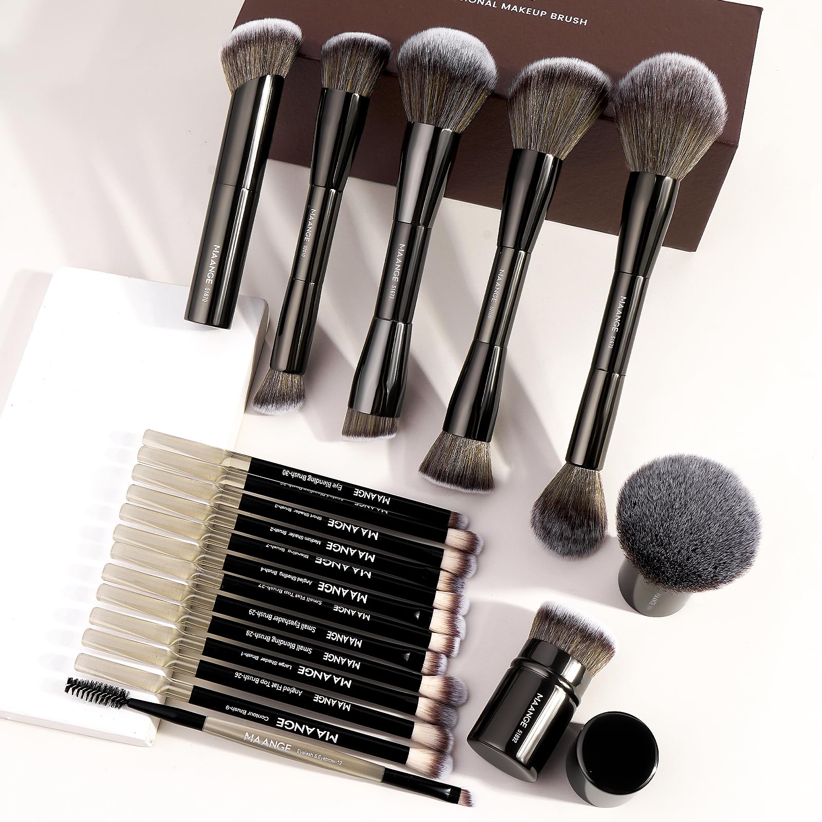 MAANGE brush held in hand for size comparison and travel-friendly convenience