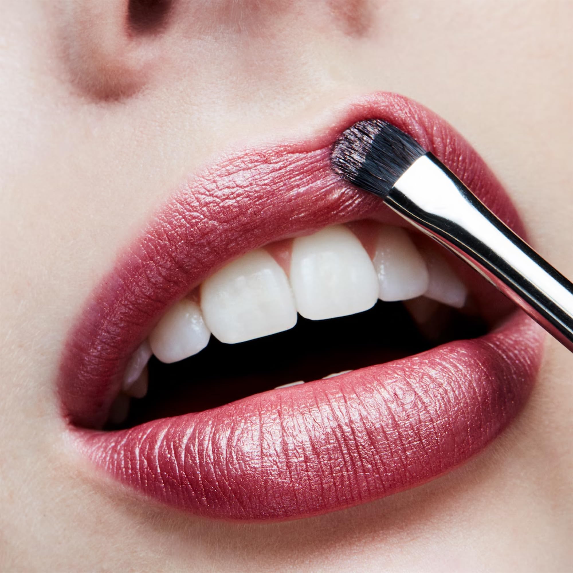 MAC Plum Dandy on model smiling showcasing flattering plum benefit