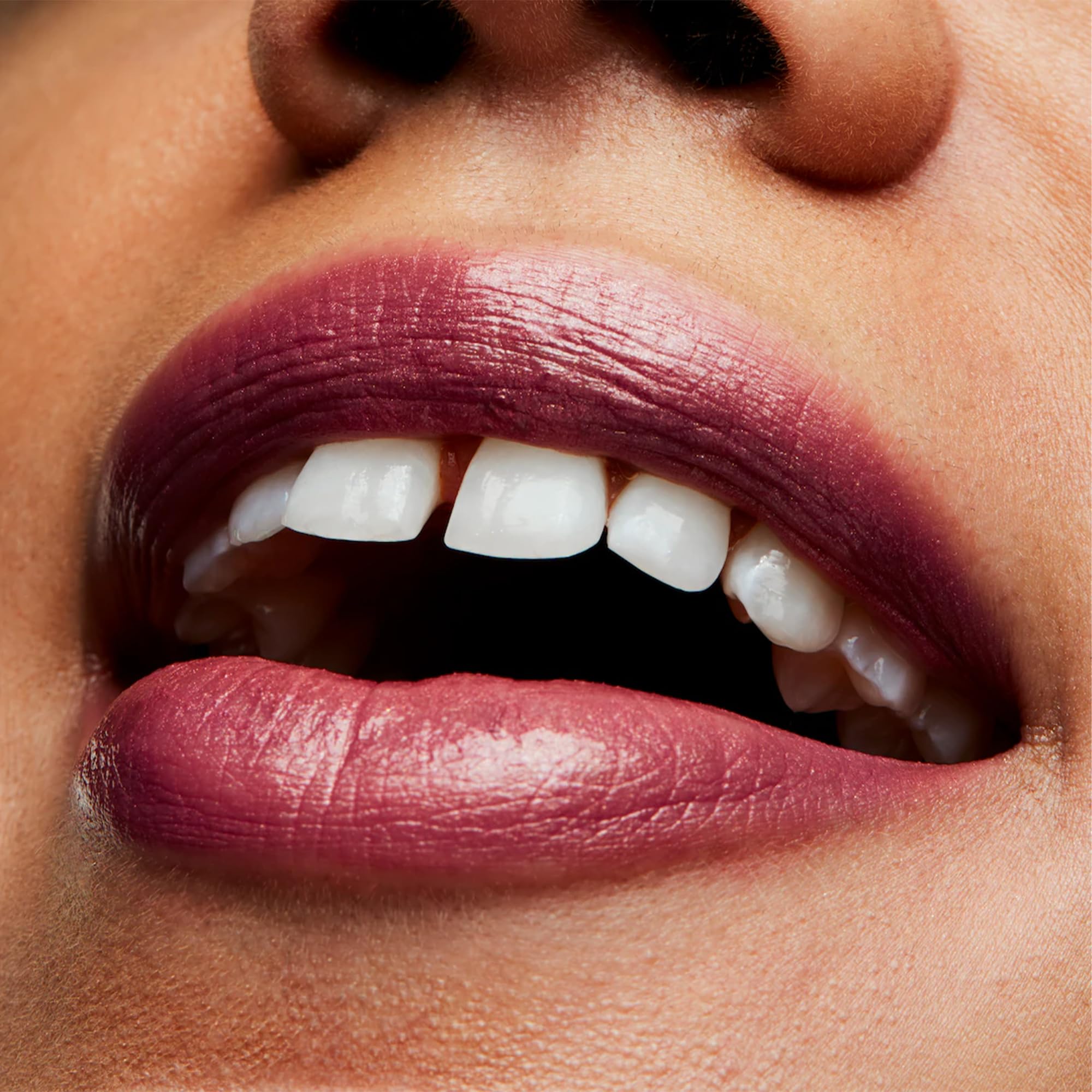 MAC lipstick next to coin showing scale and portability benefit