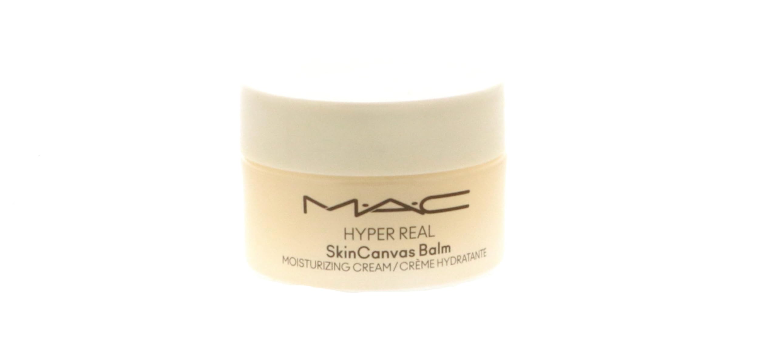 MAC Hyper Real SkinCanvas balm next to travel items illustrating portable convenience