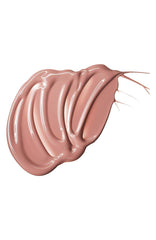 Model wearing MAC Lipglass Spite showcasing glossy pink shine benefit