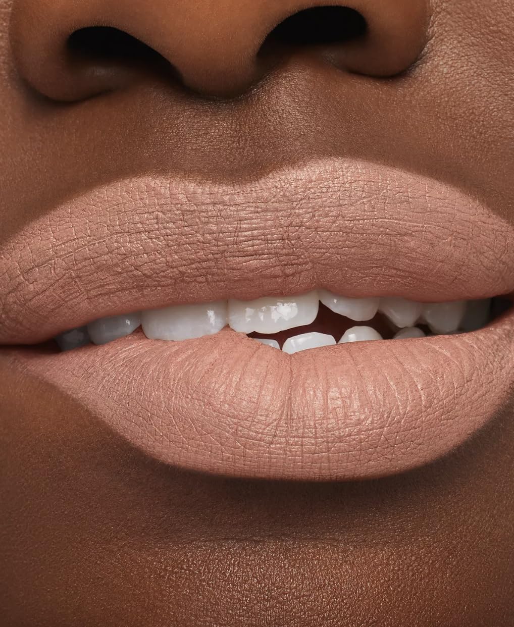MAC Macximal Honeylove texture swatch on arm showing rich pigment and smooth finish