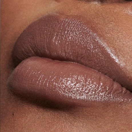 MAC lipstick swatch on forearm showing taupe brown pigment and smooth satin texture