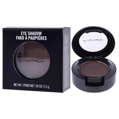 Model applying MAC Satin Taupe Frost on eyelid for long-wearing, crease-resistant definition