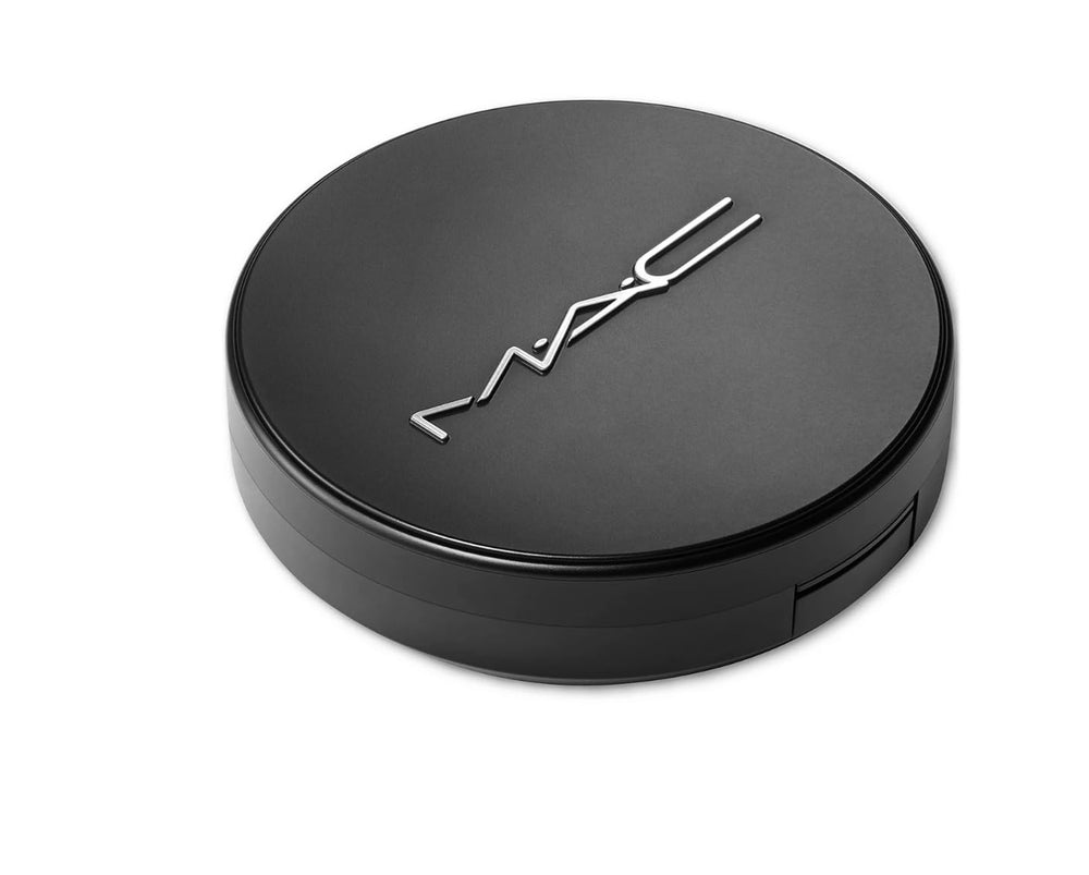 MAC Studio Fix compact held in hand showing portable size for travel convenience
