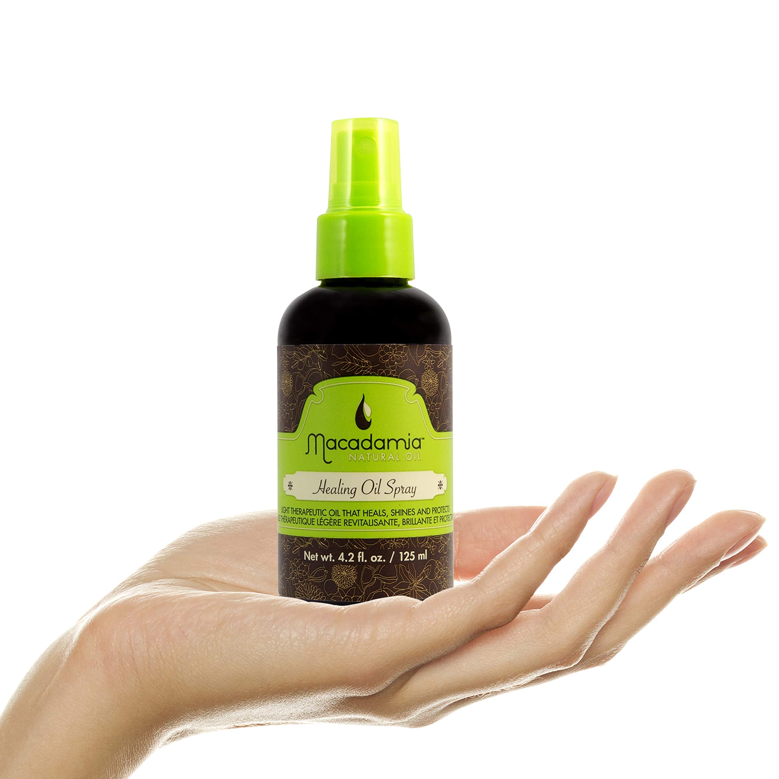 Macadamia Natural Oil bottle next to ruler showing 4.2 oz travel-friendly size