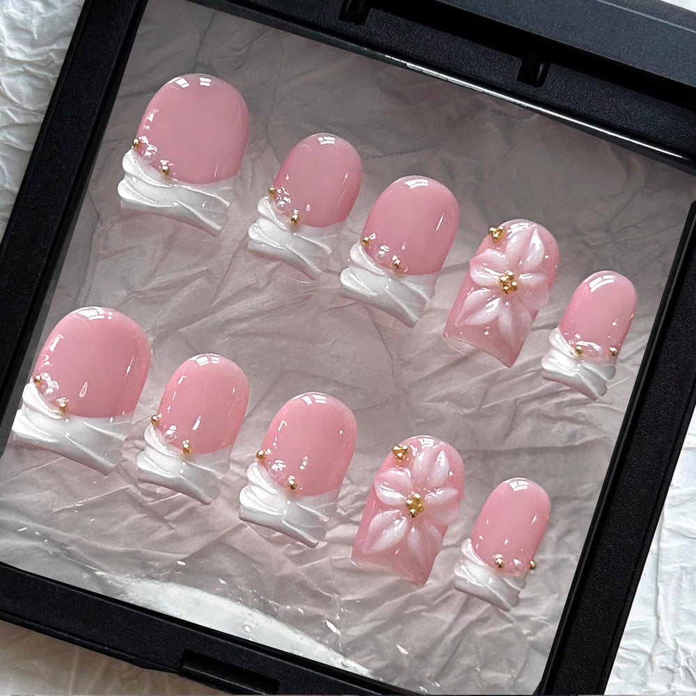 MAGLFELL front view of 10-piece box showing short square French tips for quick salon looks