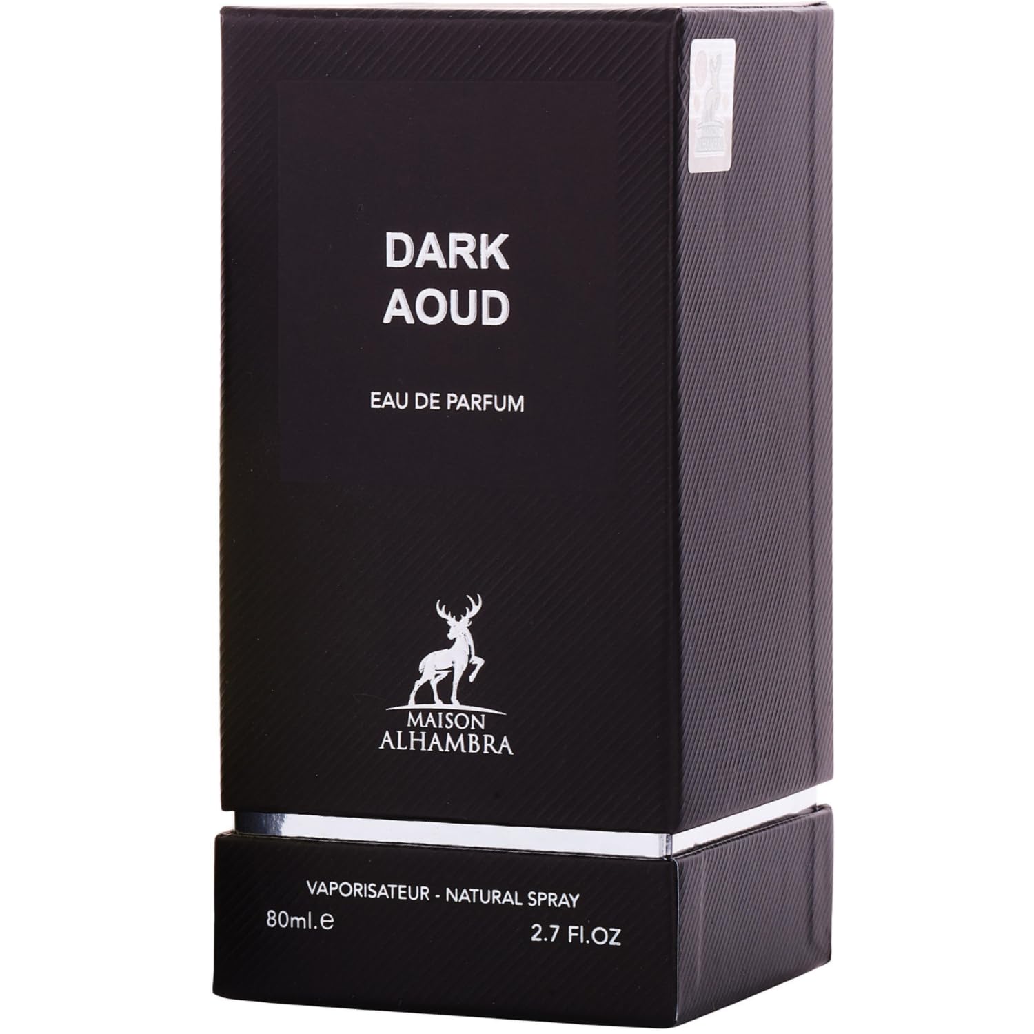 Maison Alhambra Dark Aoud lifestyle evening scene on dressing table conveying long-lasting presence