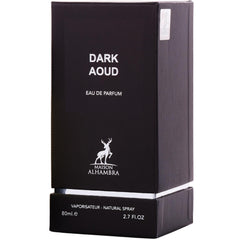 Maison Alhambra Dark Aoud lifestyle evening scene on dressing table conveying long-lasting presence