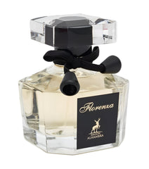 Maison Alhambra Florence bottle next to hand to show 3.4 oz scale and portability