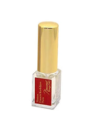 Maison Francis Kurkdjian refillable 5ml atomizer held in hand demonstrating travel convenience
