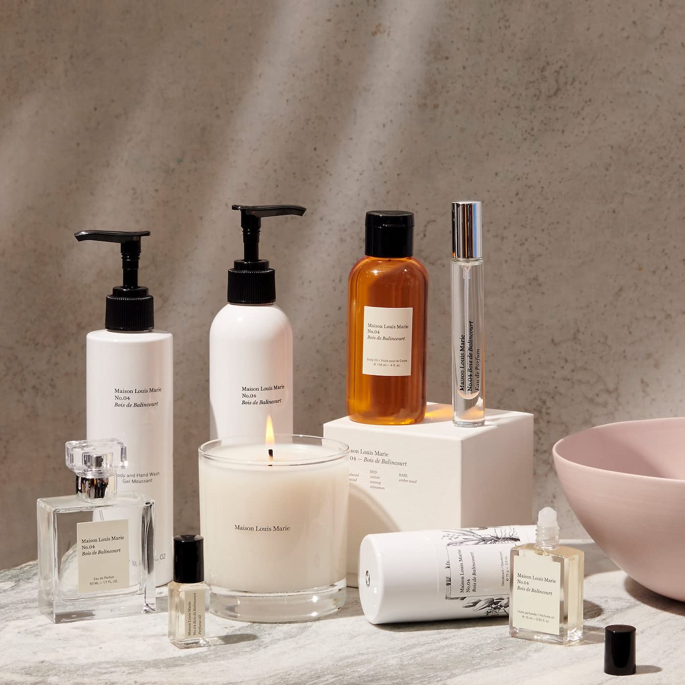 Maison Louis Marie bottle next to hand showing 50 ml scale and portable convenience