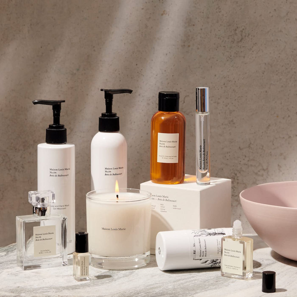 Maison Louis Marie bottle next to hand showing 50 ml scale and portable convenience