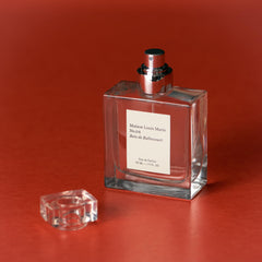 Maison Louis Marie spray in hand demonstrating easy application and travel-ready size