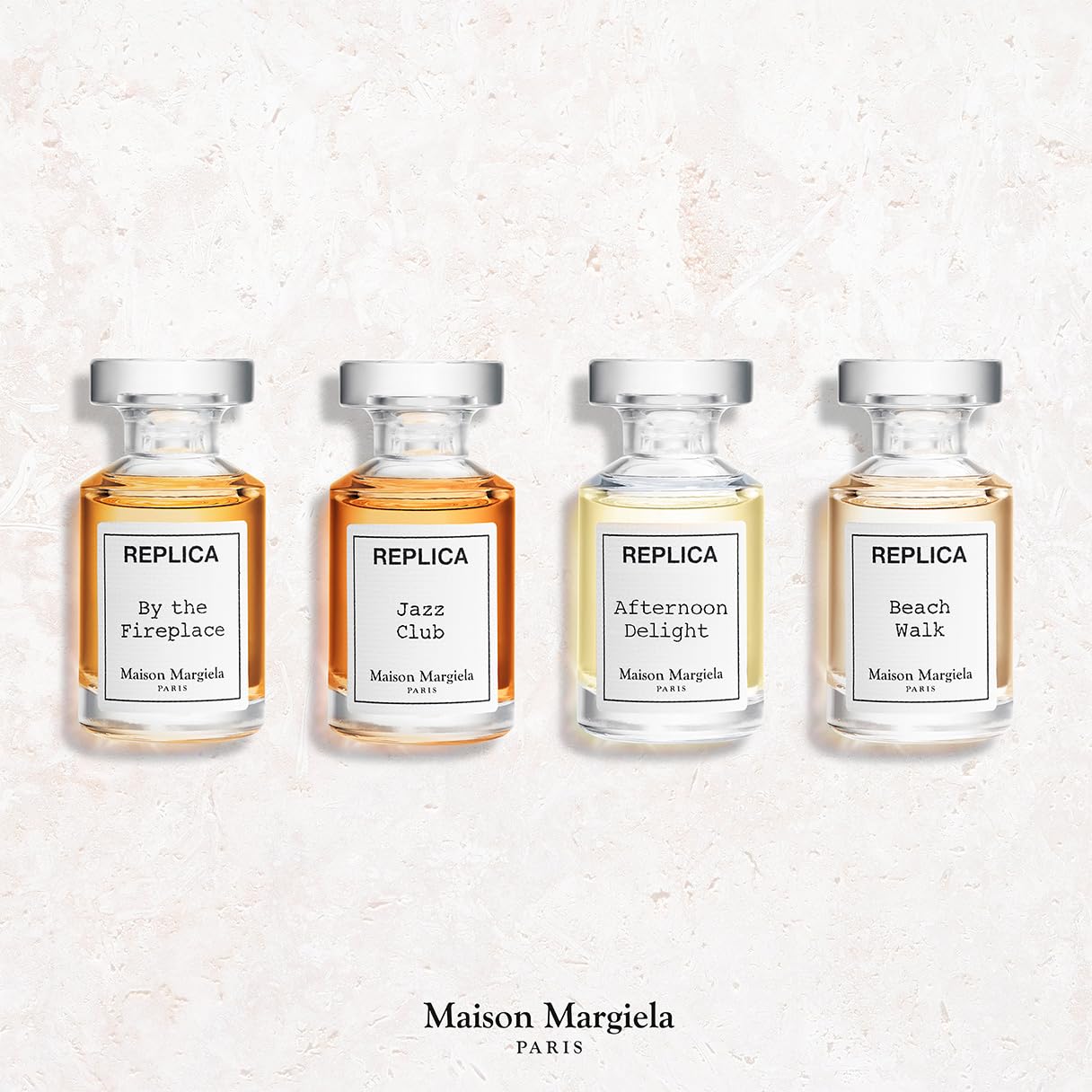 Maison Margiela close-up of a single mini bottle spray, precise application benefit