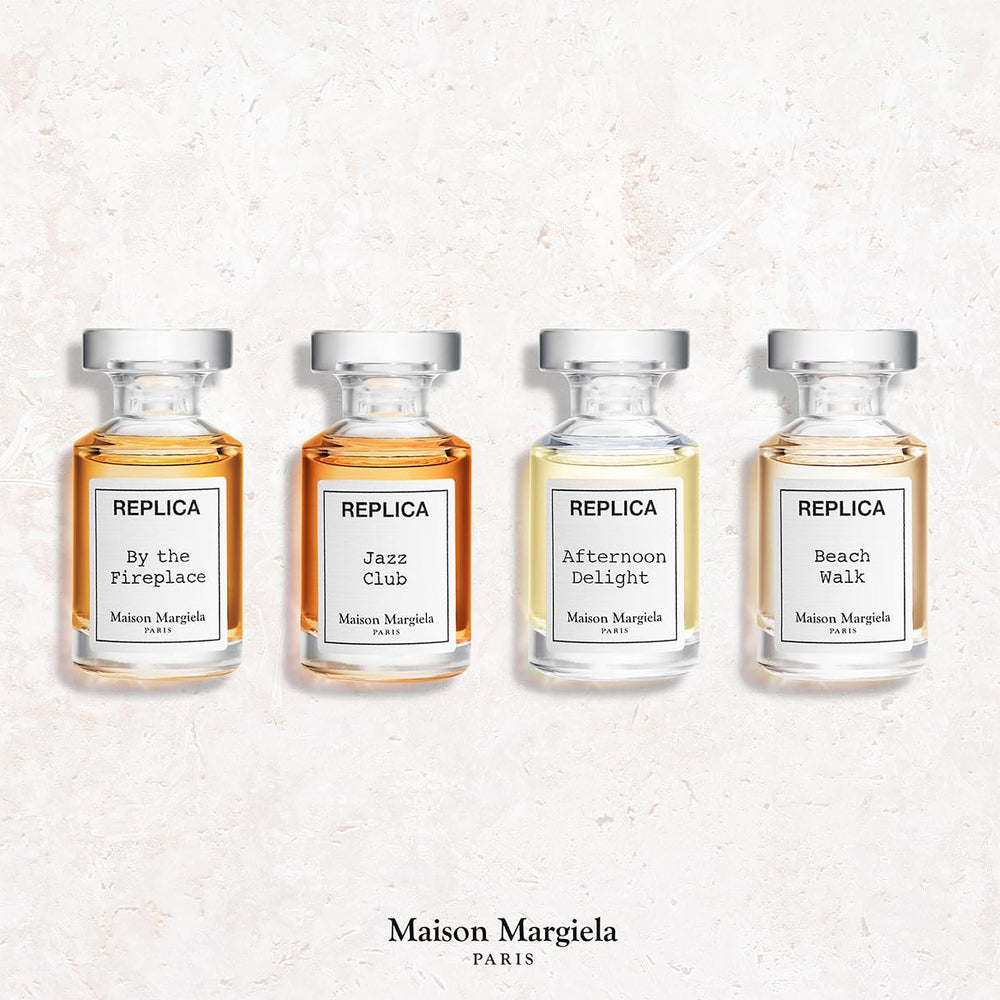 Maison Margiela close-up of a single mini bottle spray, precise application benefit