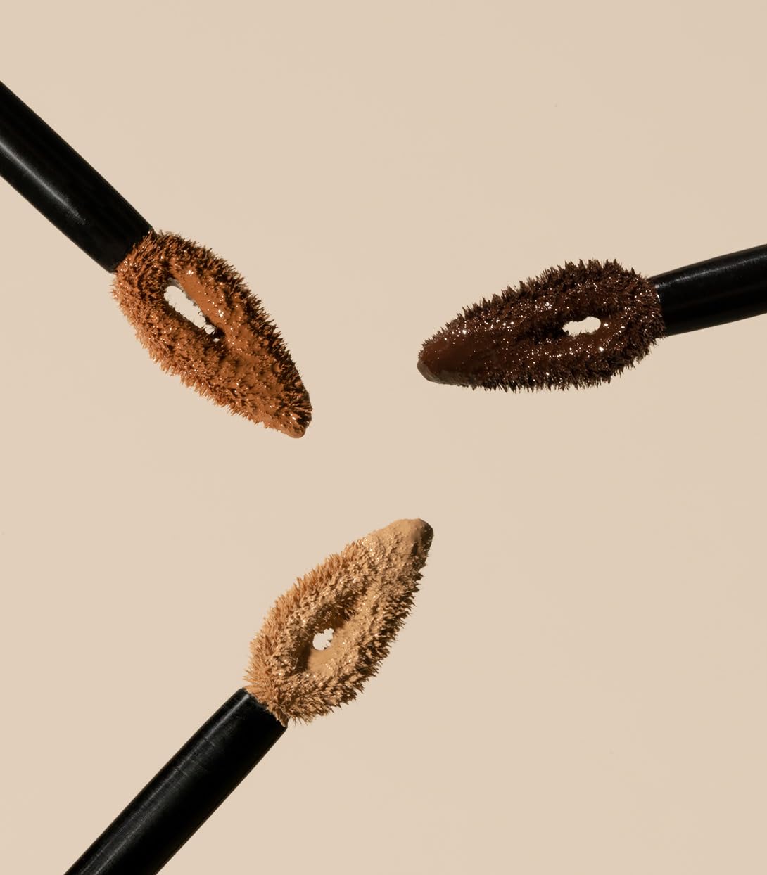 MAKE concealer being blended with finger showing easy application and smoothing