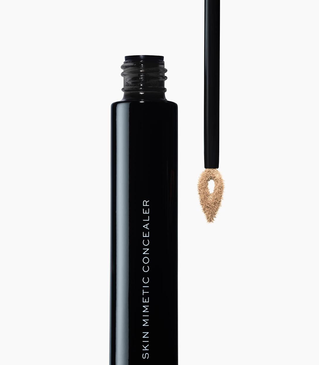 MAKE concealer texture swipe demonstrating blendable, skin-like finish