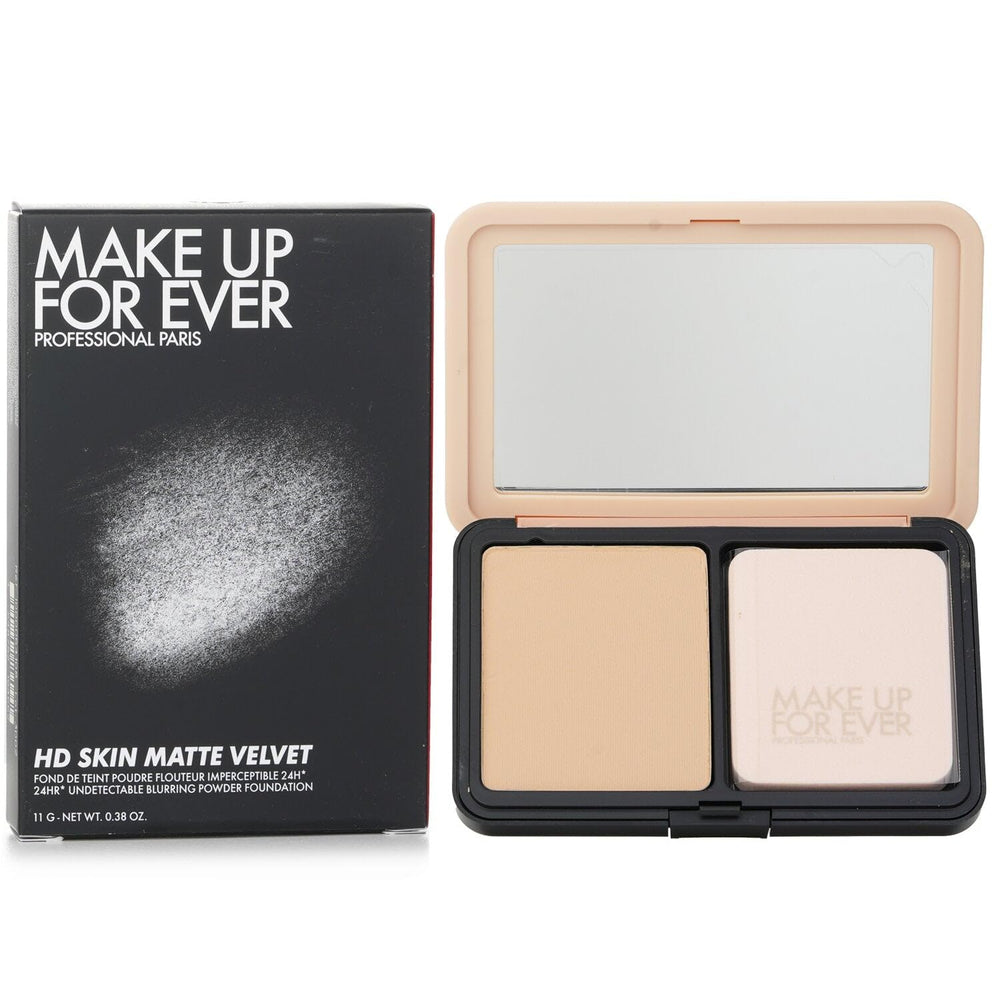 Make Up For Ever compact in hand showing scale and portable size benefit