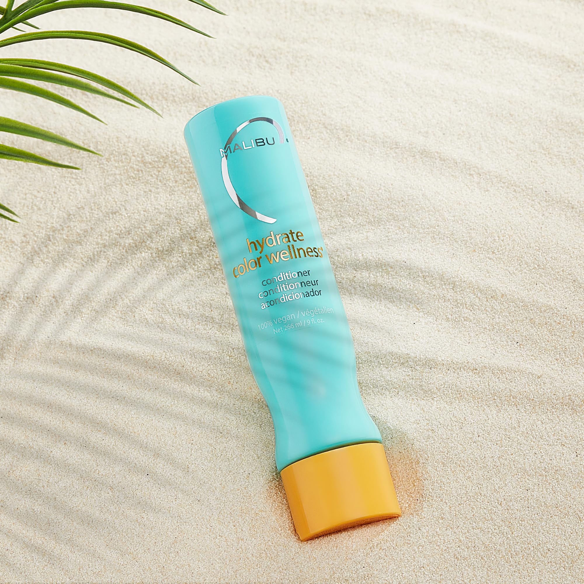 Malibu C creamy conditioner texture on finger demonstrating rich moisturizing feel