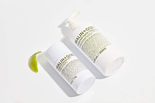 MALIN+GOETZ bottle in shower setting illustrating convenient daily use
