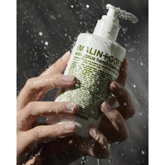 MALIN+GOETZ close-up of scrub texture, reveals pumice grains for smoothing