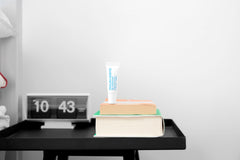 MALIN+GOETZ lip treatment in use applied to lips demonstrating smooth, non-greasy protection