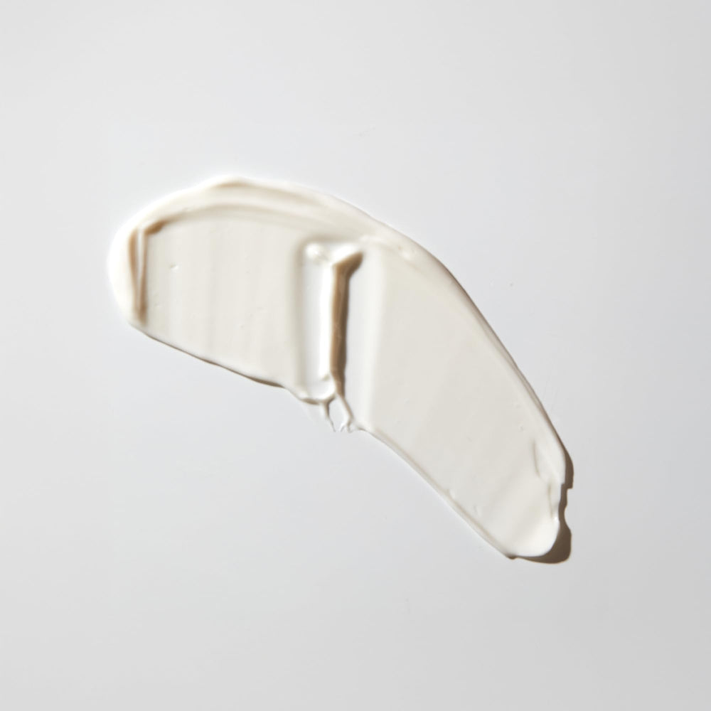 MALIN+GOETZ moisturizer on hand demonstrating quick absorption benefit