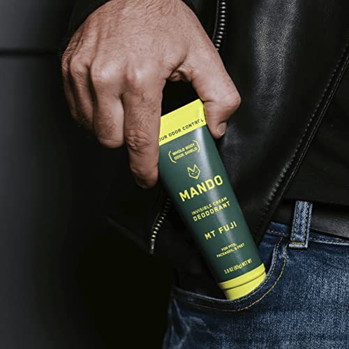 Mando applied underarm in demonstration image, promoting confident odor protection