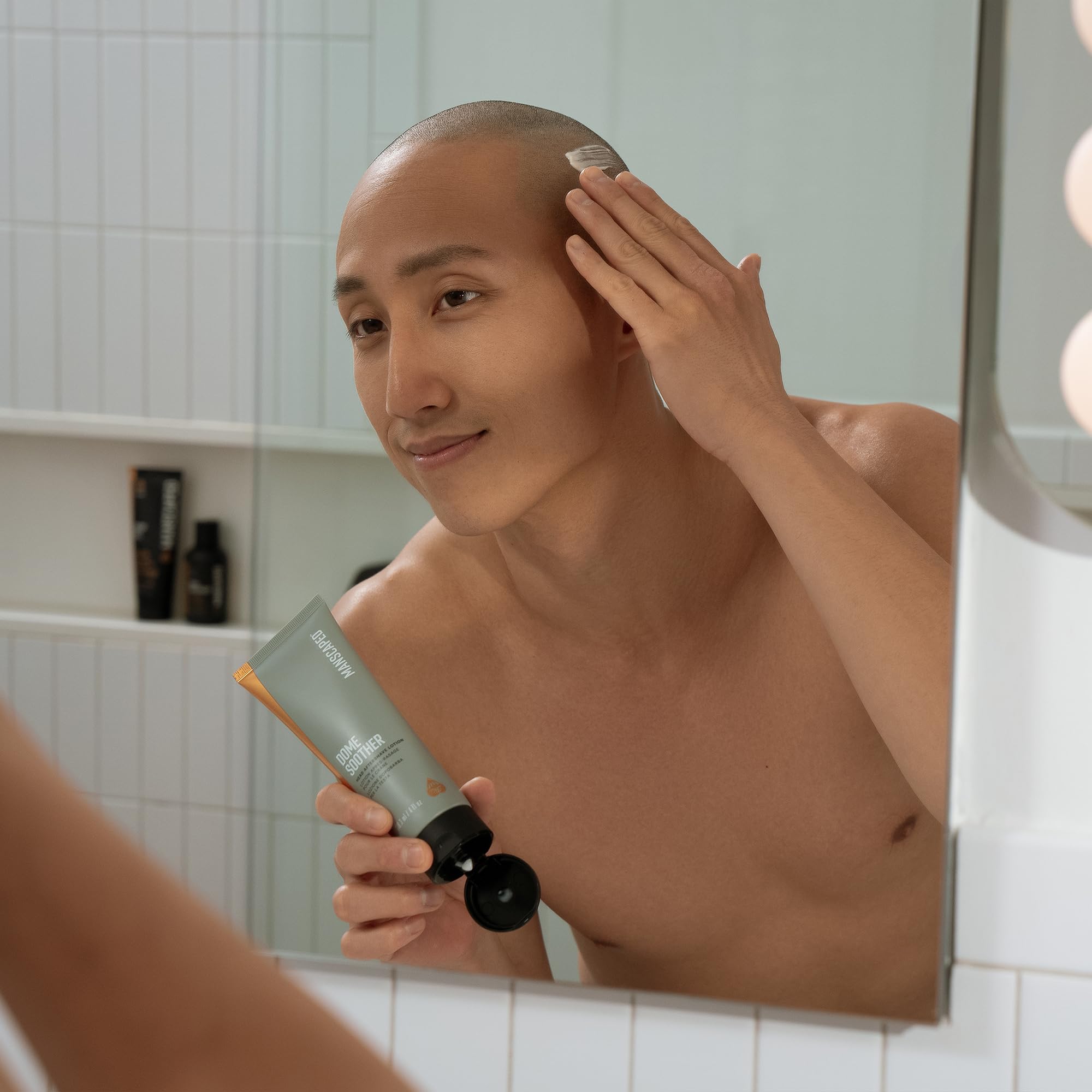 MANSCAPED Dome Soother bottle showing calming aftershave for hydrated scalp