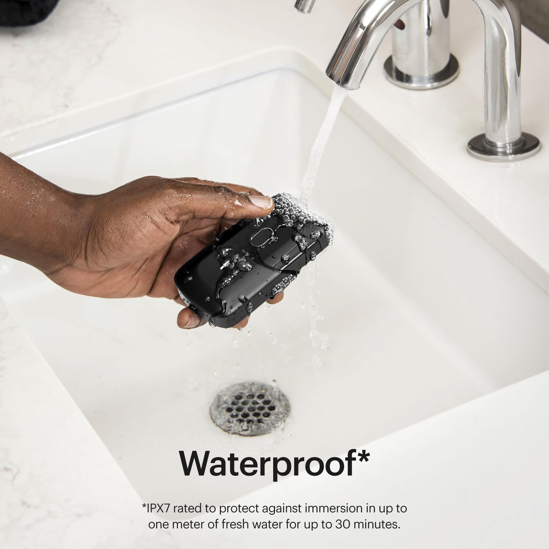 MANSCAPED replacement blade rinsing under faucet, waterproof cleaning benefit