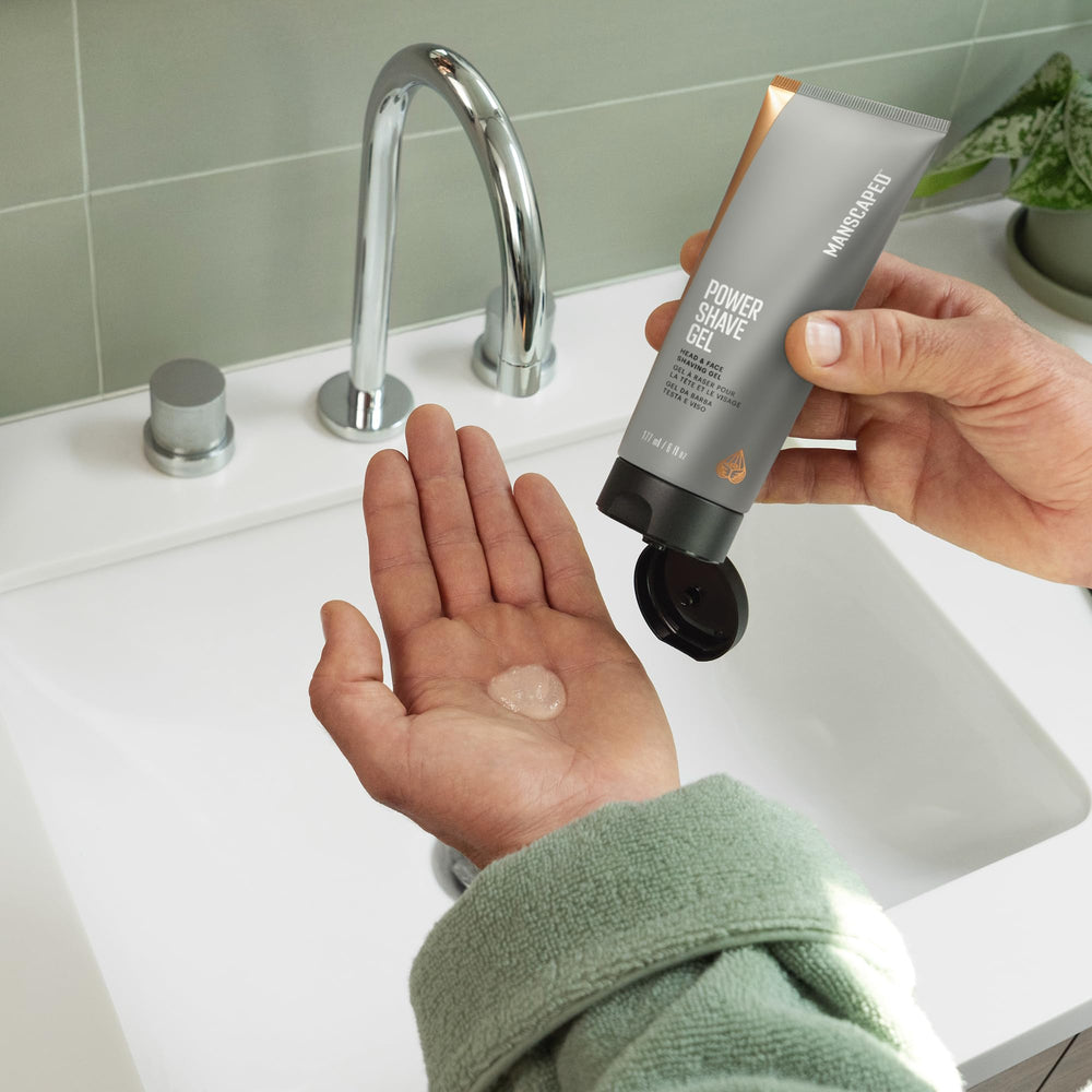 MANSCAPED shaver in use on a model demonstrating precise scalp shaving