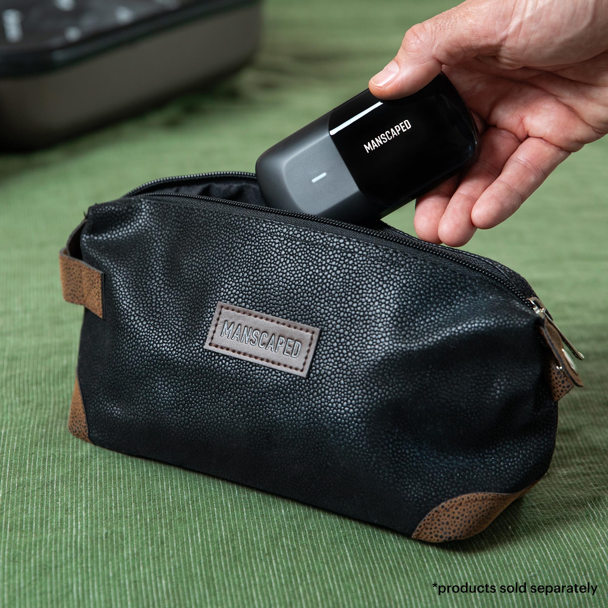 MANSCAPED bag on bathroom counter with grooming items — reduces clutter and keeps items discreet