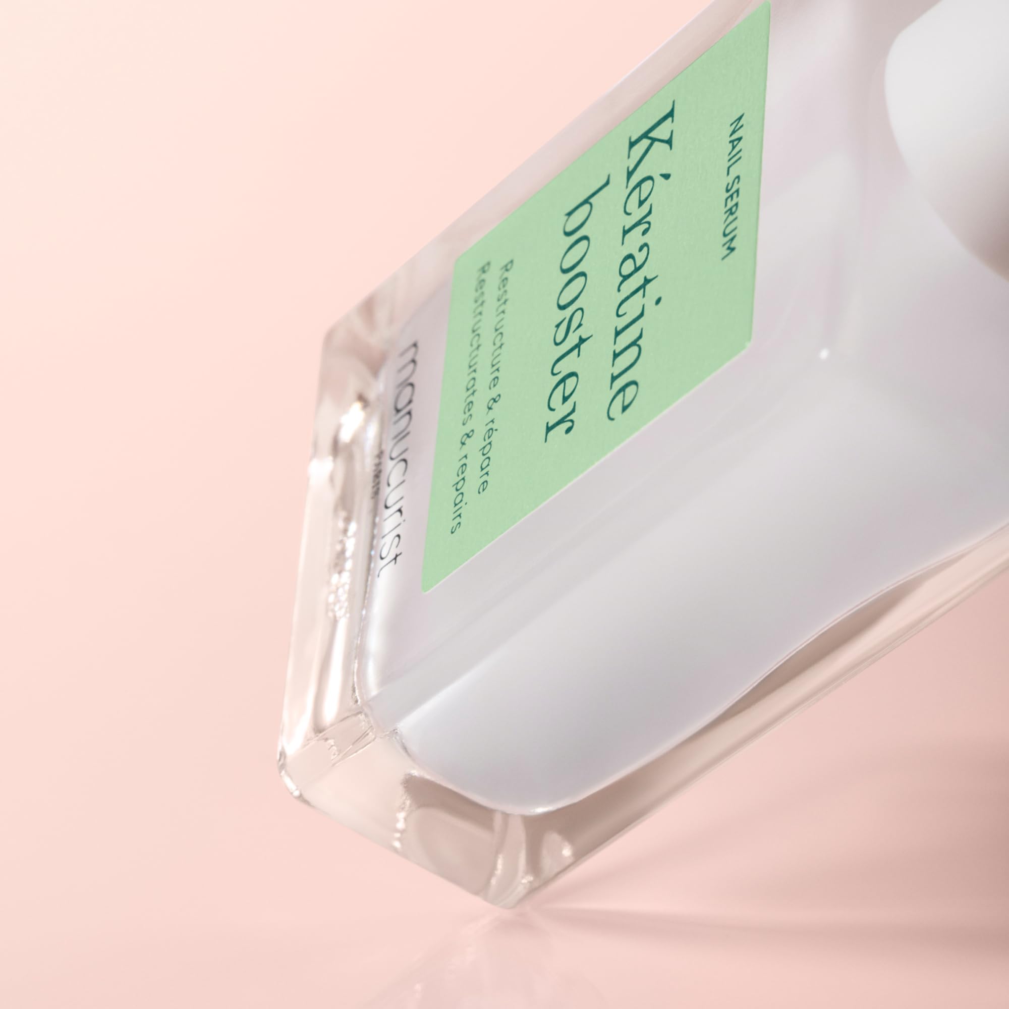 Manucurist on model hands showing polished natural look benefit