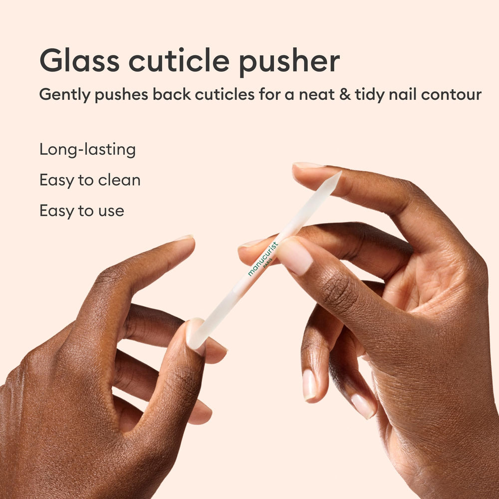 Manucurist tools beside a hand for size comparison showing compact portability benefit