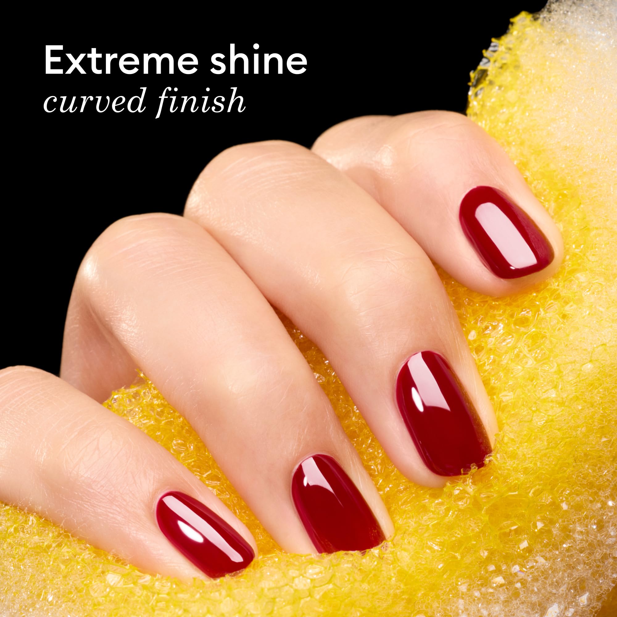 Manucurist applied in salon setting curing under LED lamp for durable shine
